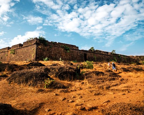 Tourists go to the ruins of Chapora fort, located near Vagator village, North Goa, India